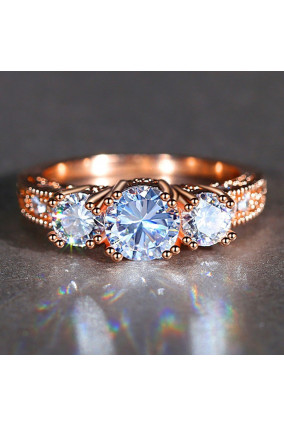 Three Solitaires Champagne Ring