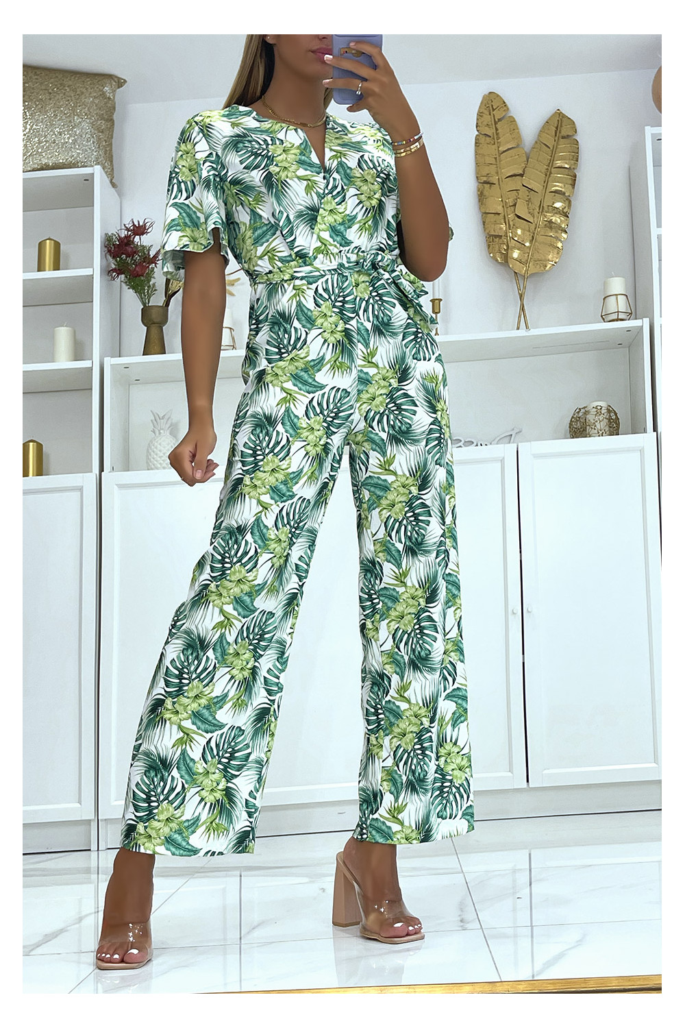 White floral wrap jumpsuit straight cut elastic at the waist and printed  with large hibiscus flowers