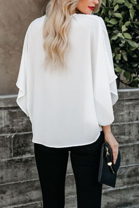 White blouse with black V-neck