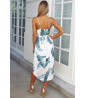 White mid-length dress with green print